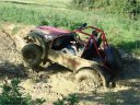 Suzuki buggy stuck in mud hole